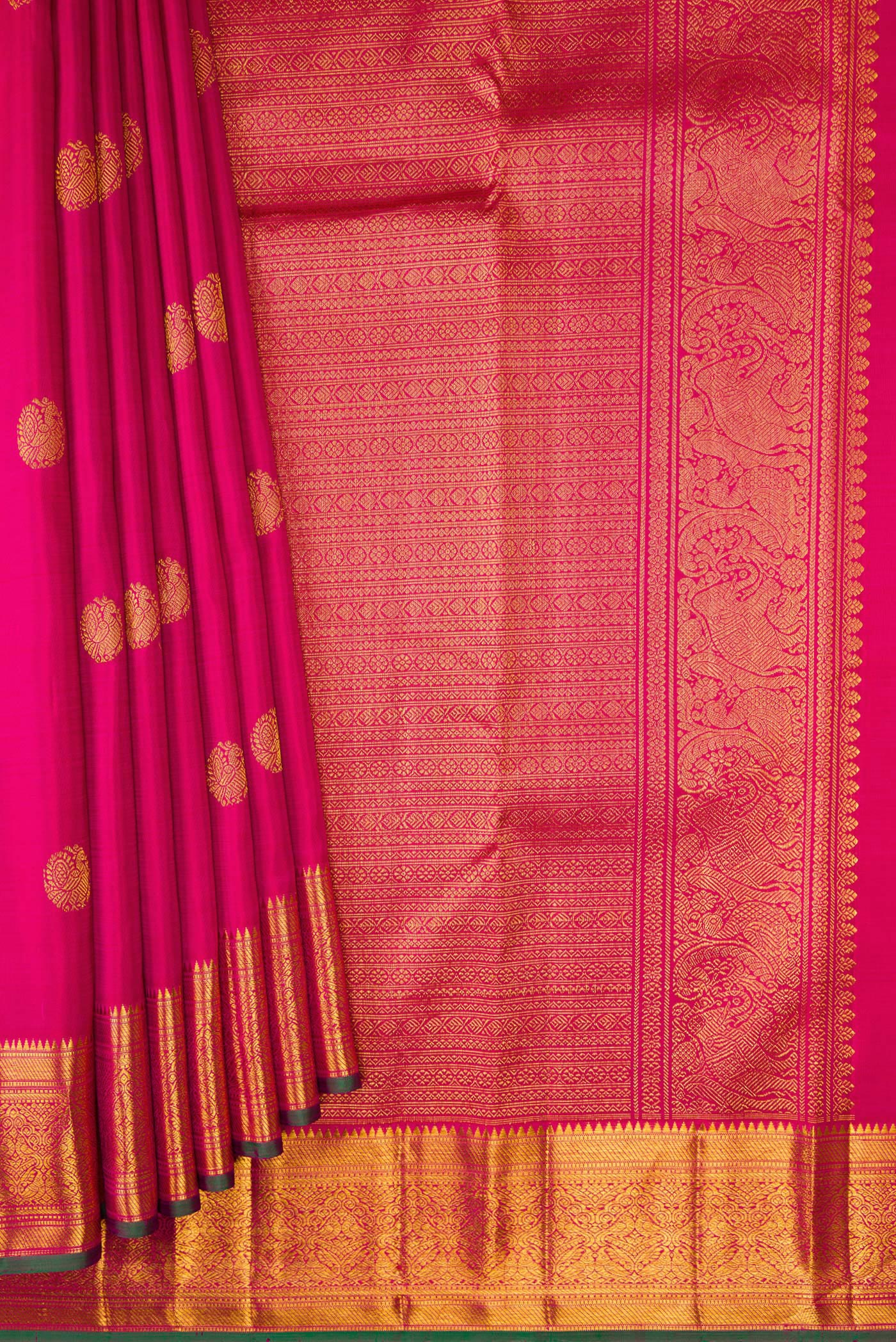 Pleats and pallu of Pink Kanjivaram Silk Saree with Zari Butta on the body and Zari Border. 