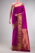 Magenta Kanchipuram Silk Saree with Zari Butta on the body and Zari Border.  displayed on a mannequin