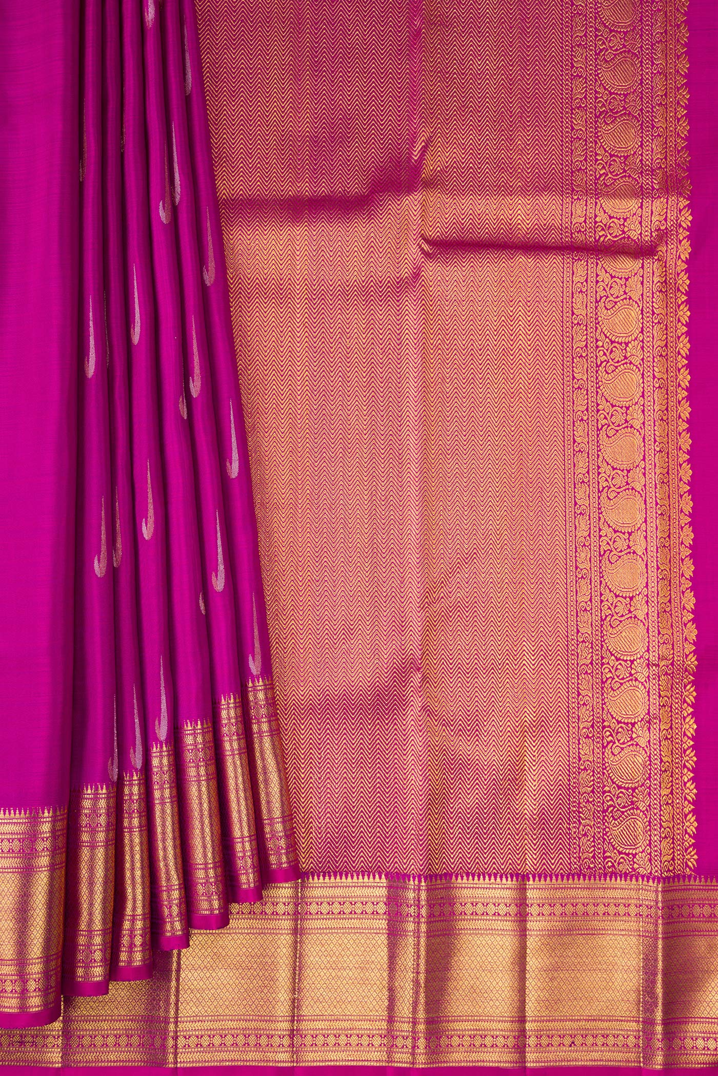 Pleats and pallu of Magenta Kanchipuram Silk Saree with Zari Butta on the body and Zari Border. 