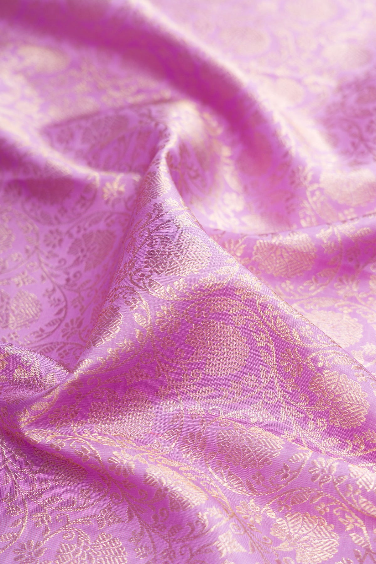 Close up of Pure Silk Lavender Kanchipuram Saree with Zari Brocade on the body and Zari Border.  displaying folds
