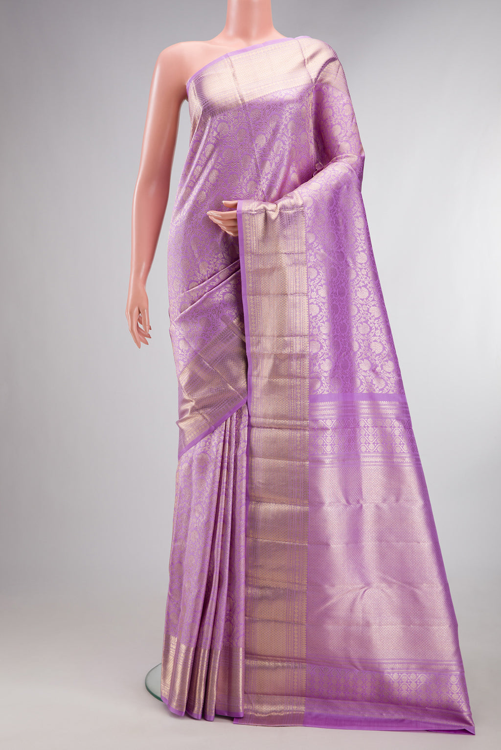 Pure Silk Lavender Kanchipuram Saree with Zari Brocade on the body and Zari Border.  displayed on a mannequin
