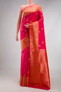 Pink Kanchipuram Silk Saree with Zari Butta on the body and Zari Border.  displayed on a mannequin