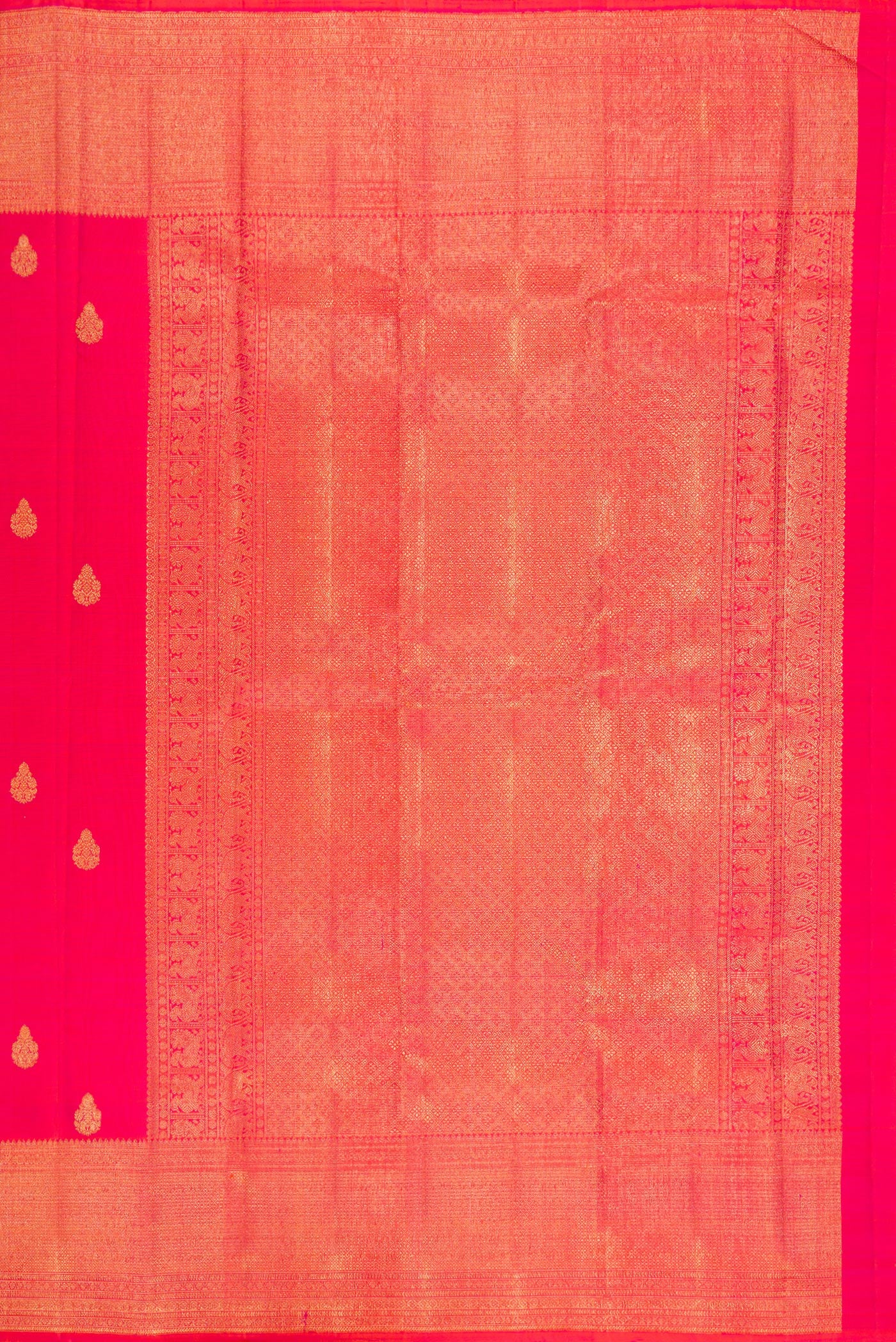 Close up image of the pallu of Pink Kanchipuram Silk Saree with Zari Butta on the body and Zari Border. 