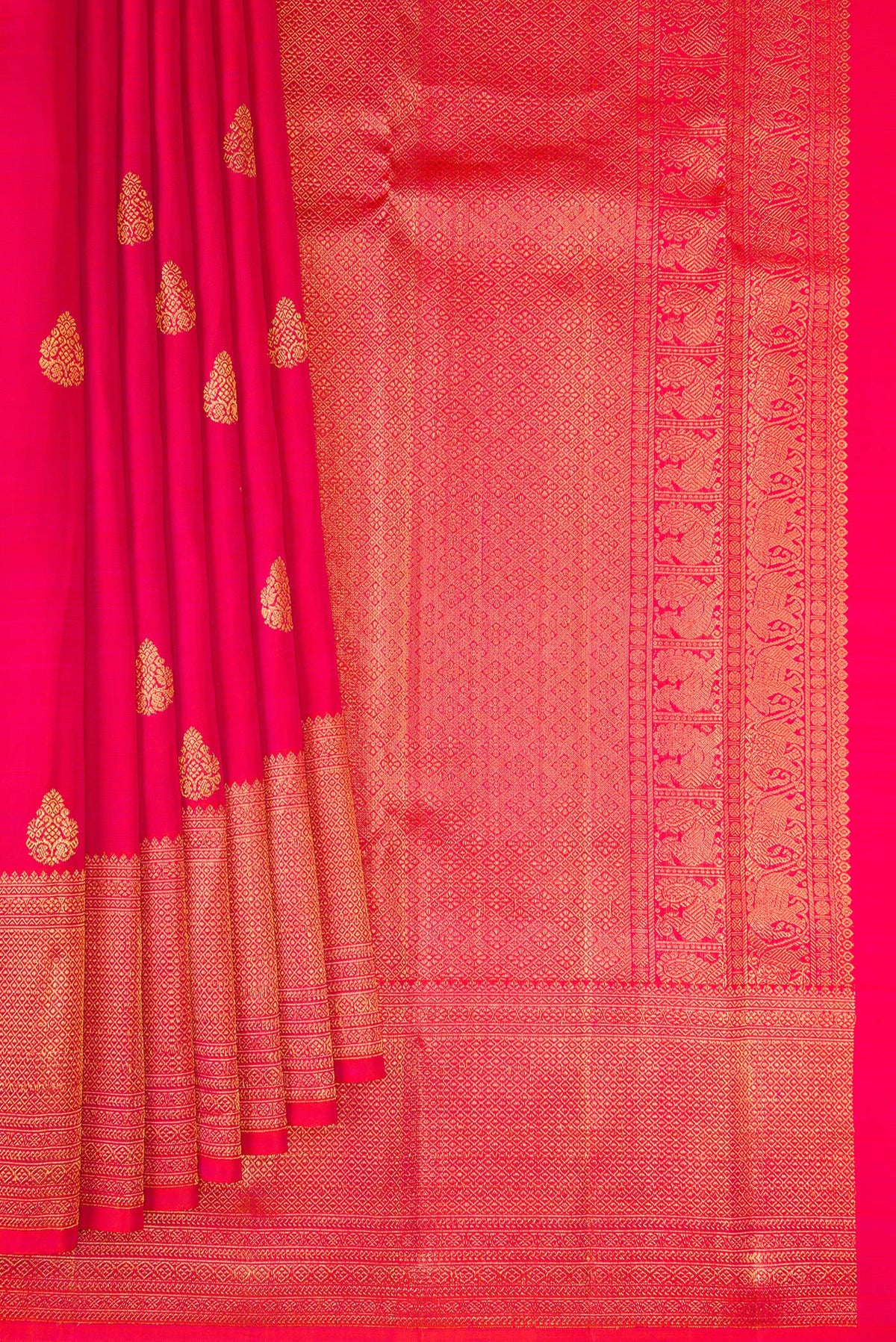 Pleats and pallu of Pink Kanchipuram Silk Saree with Zari Butta on the body and Zari Border. 