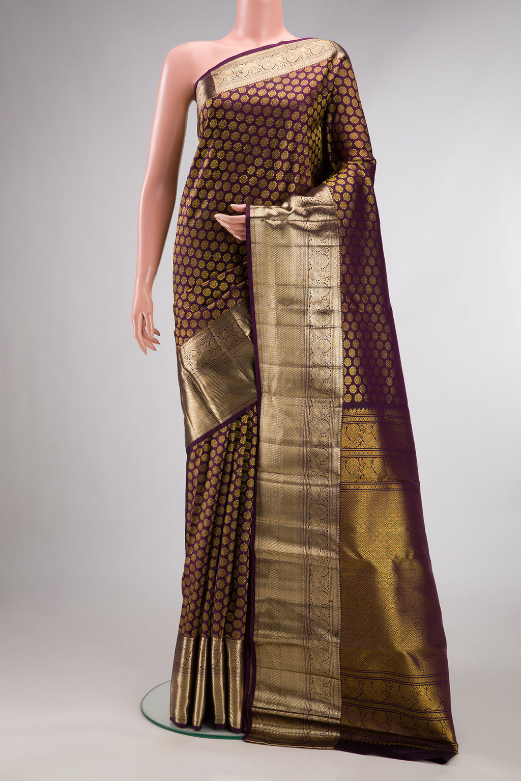 Pure Silk Burgundy Dual Tone Kanchipuram Saree with Zari Brocade on the body and Zari Border.  displayed on a mannequin