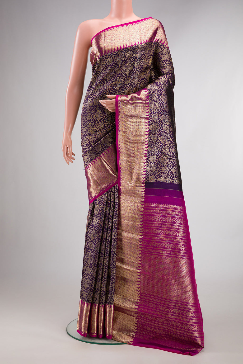 Pure Silk Violet Kanchipuram Saree with Zari Brocade on the body and Zari Border.  displayed on a mannequin
