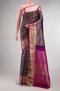 Pure Silk Violet Kanchipuram Saree with Zari Brocade on the body and Zari Border.  displayed on a mannequin