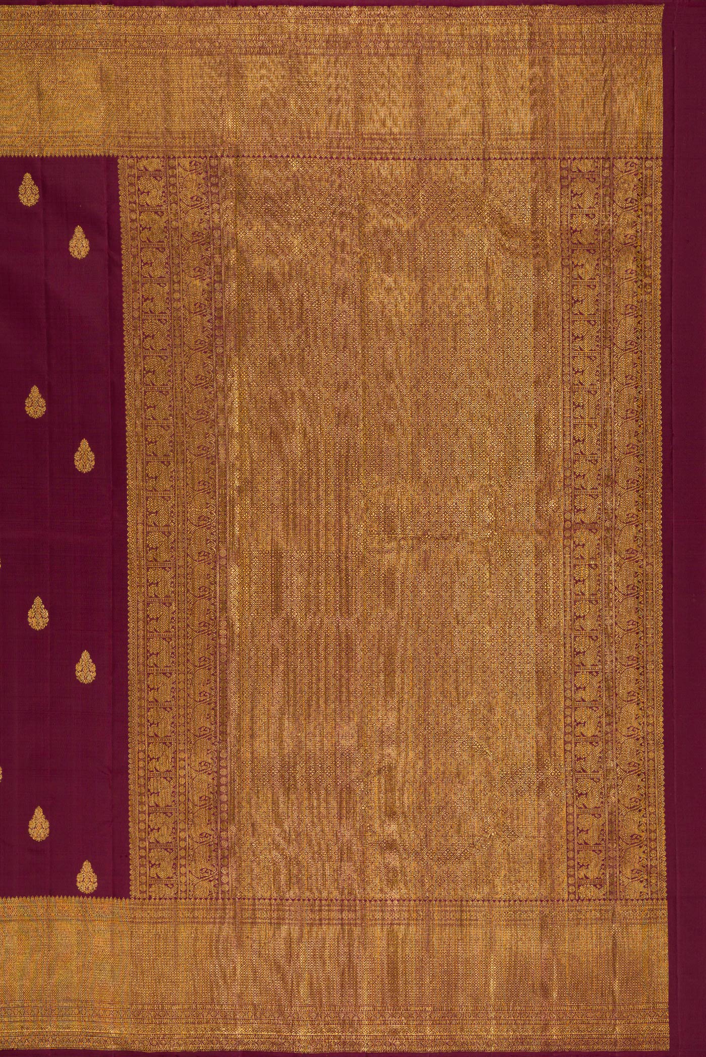 Close up image of the pallu of Coffee Brown Kanchipuram Silk Saree with Zari Butta on the body and Zari Border. 