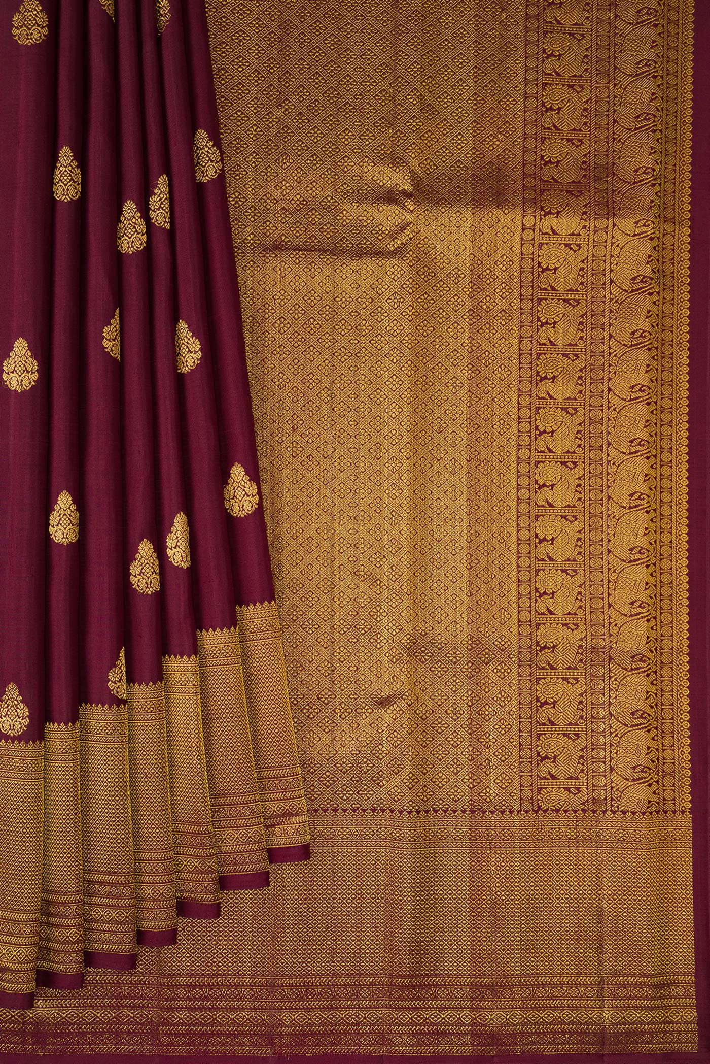 Pleats and pallu of Coffee Brown Kanchipuram Silk Saree with Zari Butta on the body and Zari Border. 