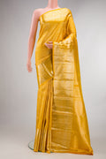 Pure Silk Yellow Kanchipuram Saree with Zari Brocade on the body and Fancy Border.  displayed on a mannequin