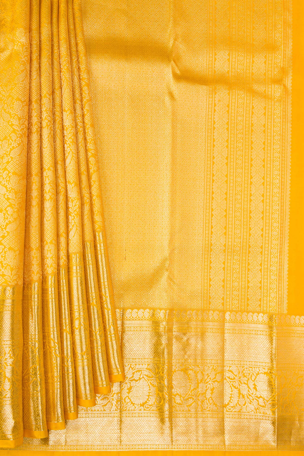 Pleats and pallu of Pure Silk Yellow Kanchipuram Saree with Zari Brocade on the body and Fancy Border. 