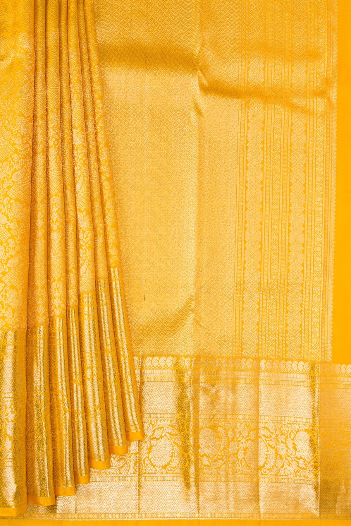 Pleats and pallu of Pure Silk Yellow Kanchipuram Saree with Zari Brocade on the body and Fancy Border. 