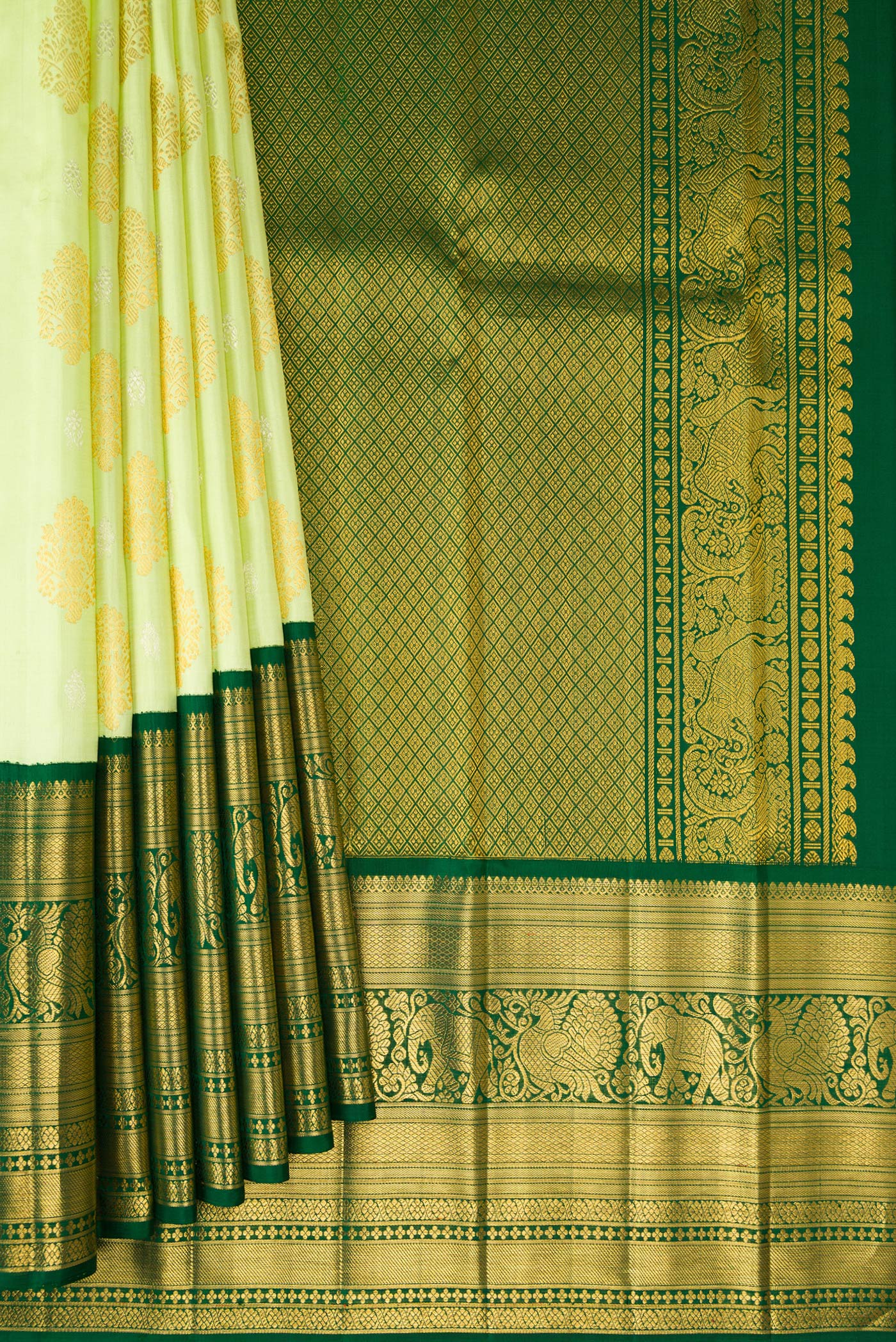 Pleats and pallu of Pista Green Kanchipuram Silk Saree with Zari Butta on the body and Zari Border. 