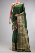 Bottle Green Kanchipuram Silk Saree with Checked design on the body and Zari Border.  displayed on a mannequin