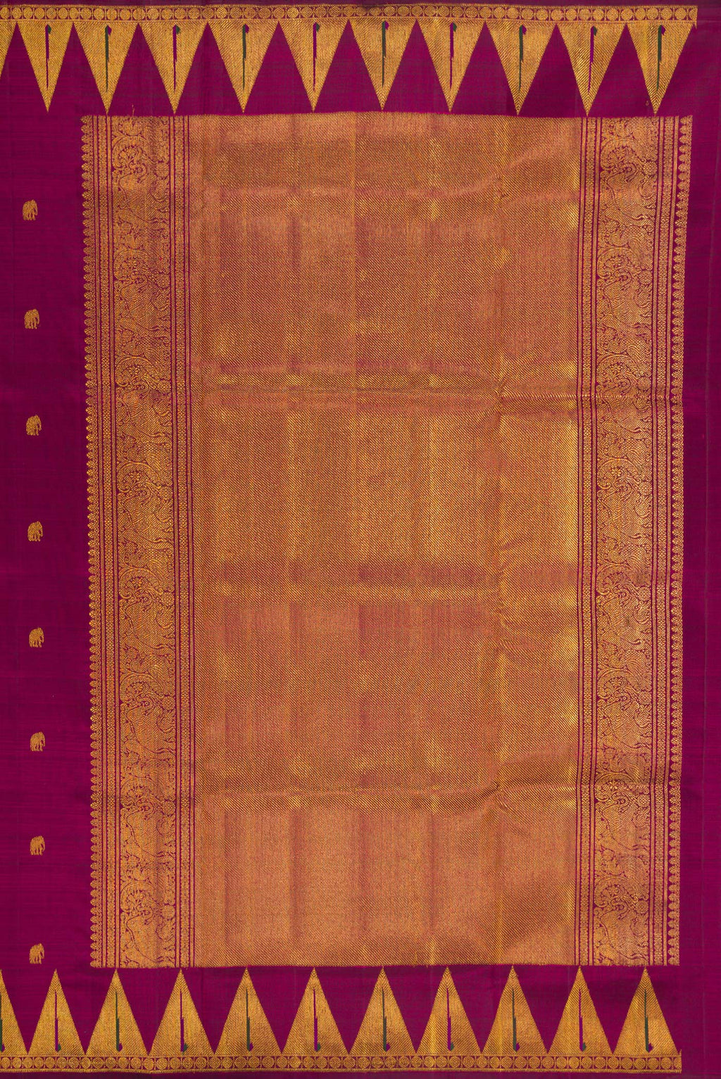 Close up image of the pallu of Magenta Kanchipuram Silk Saree with Zari Butta on the body and Temple Border. 