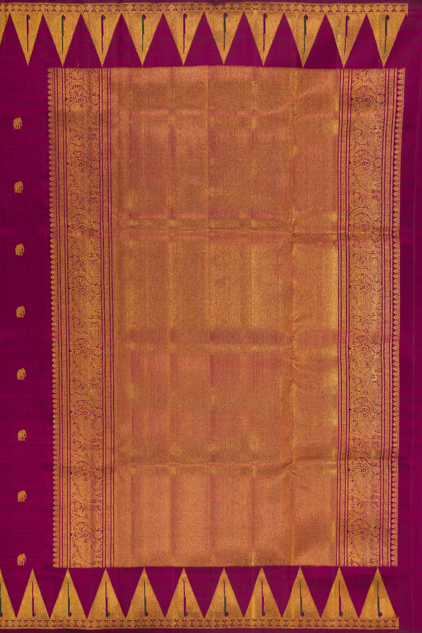 Close up image of the pallu of Magenta Kanchipuram Silk Saree with Zari Butta on the body and Temple Border. 
