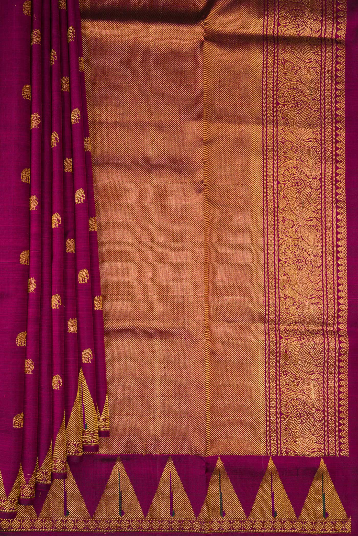 Pleats and pallu of Magenta Kanchipuram Silk Saree with Zari Butta on the body and Temple Border. 