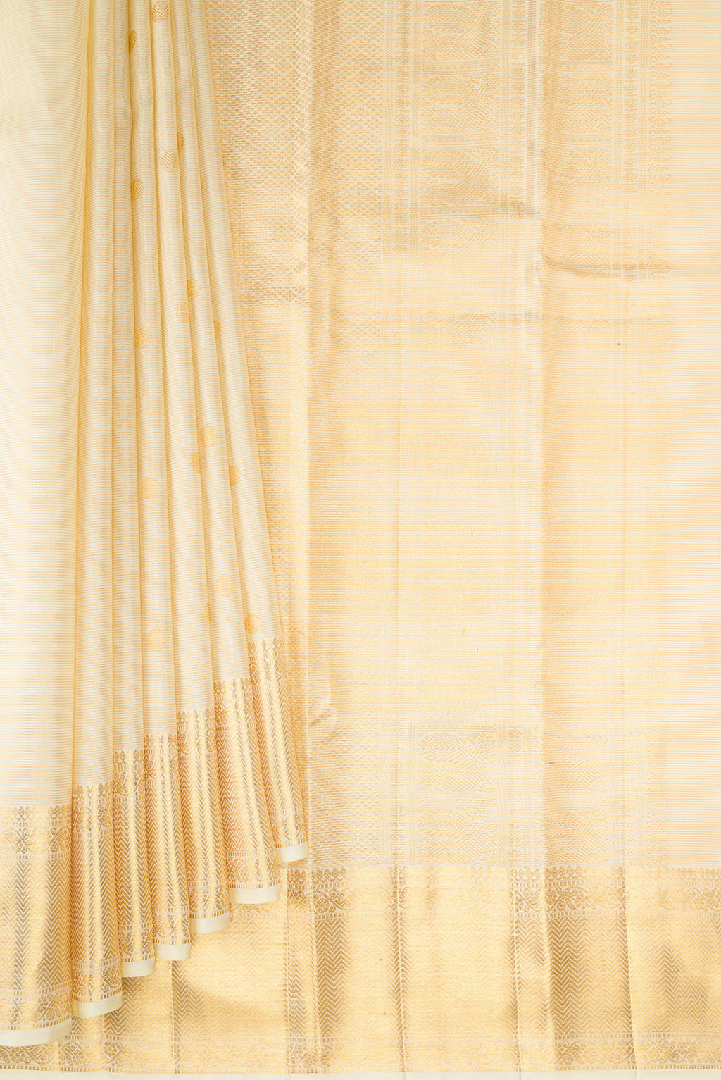 Pleats and pallu of Pure Silk Sandal Kanchipuram Saree with Zari Butta on the body and Zari Border. 