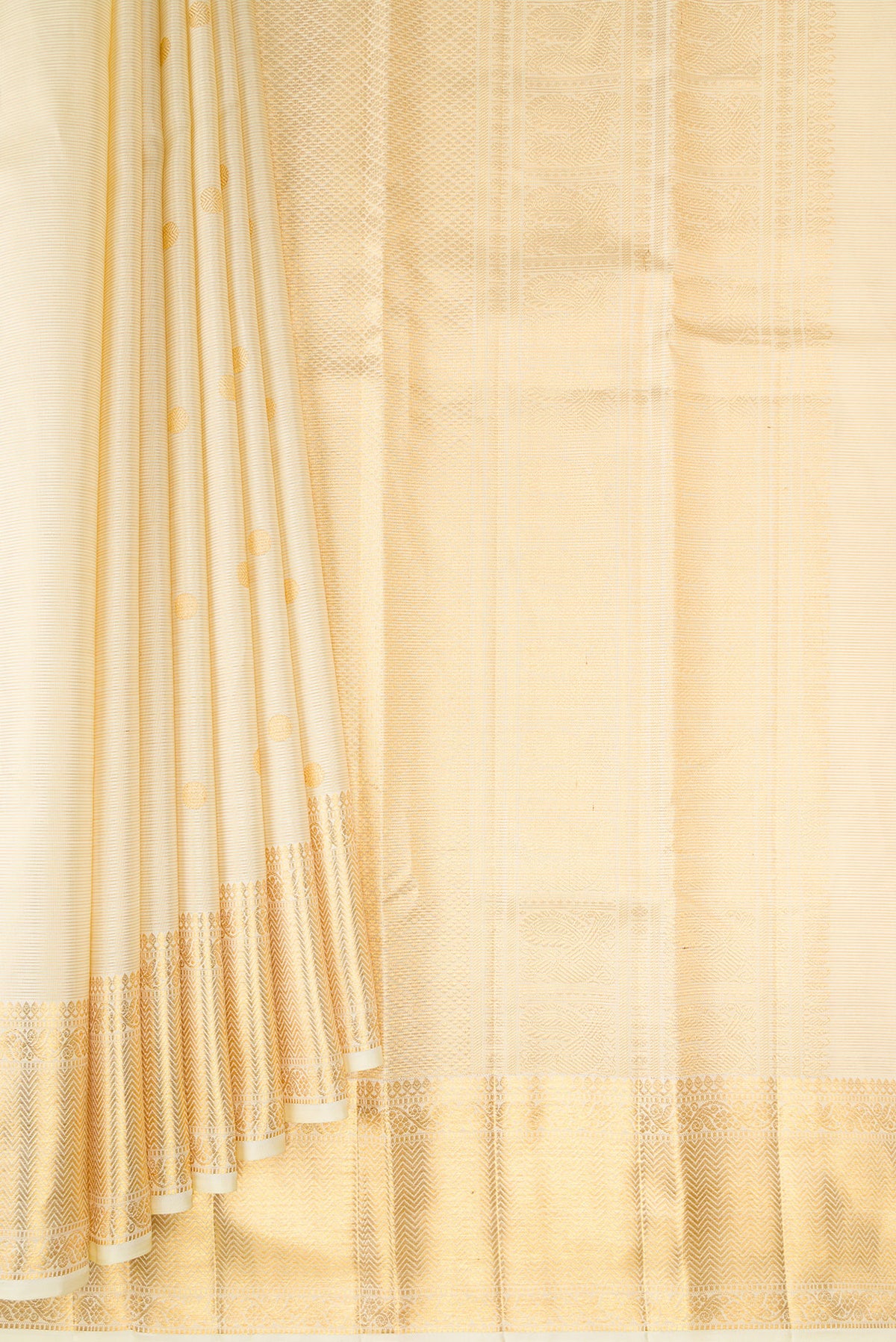 Pleats and pallu of Pure Silk Sandal Kanchipuram Saree with Zari Butta on the body and Zari Border. 