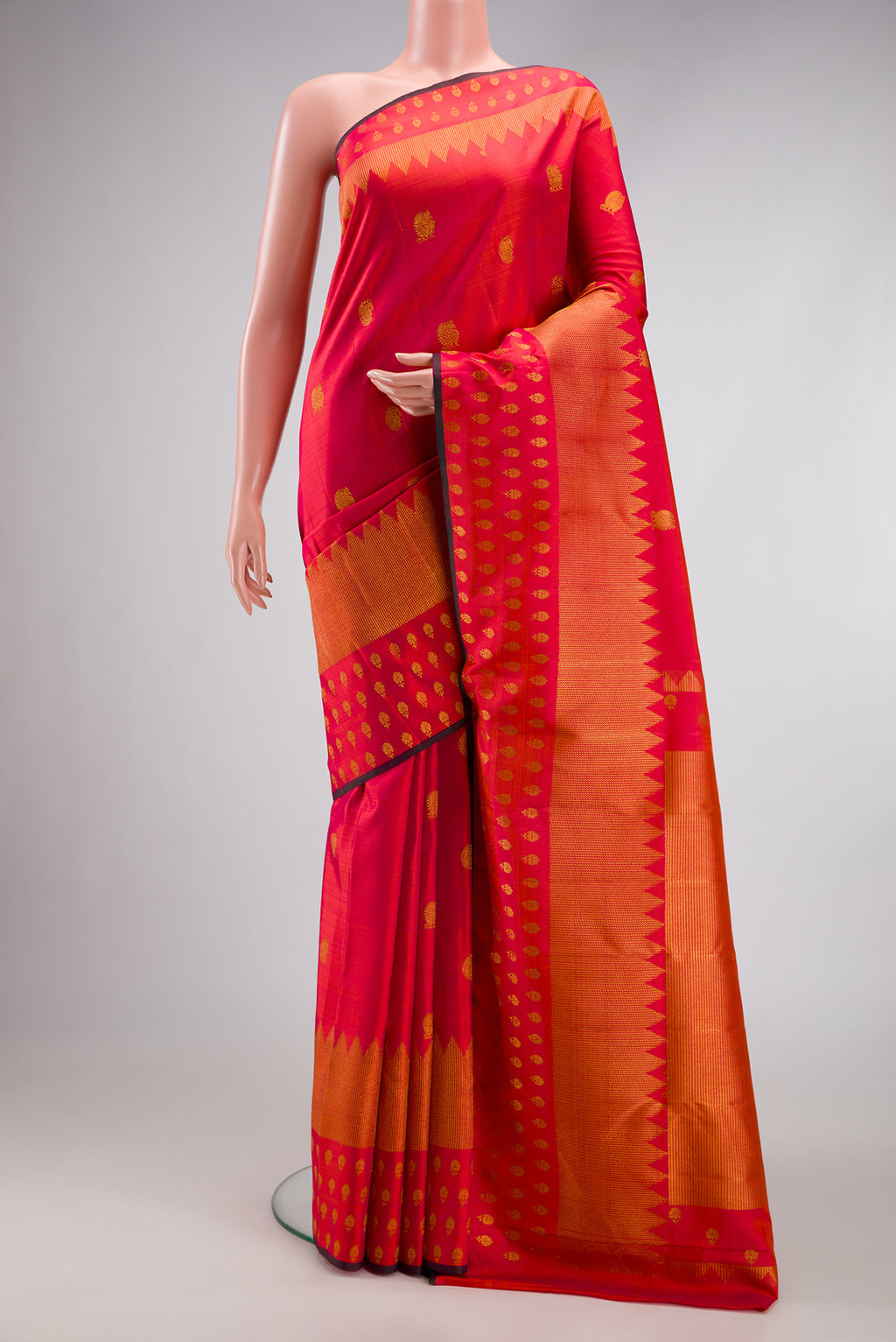 Pink Dual Tone Kanchipuram Silk Saree with Zari Butta on the body and Fancy Border.  displayed on a mannequin