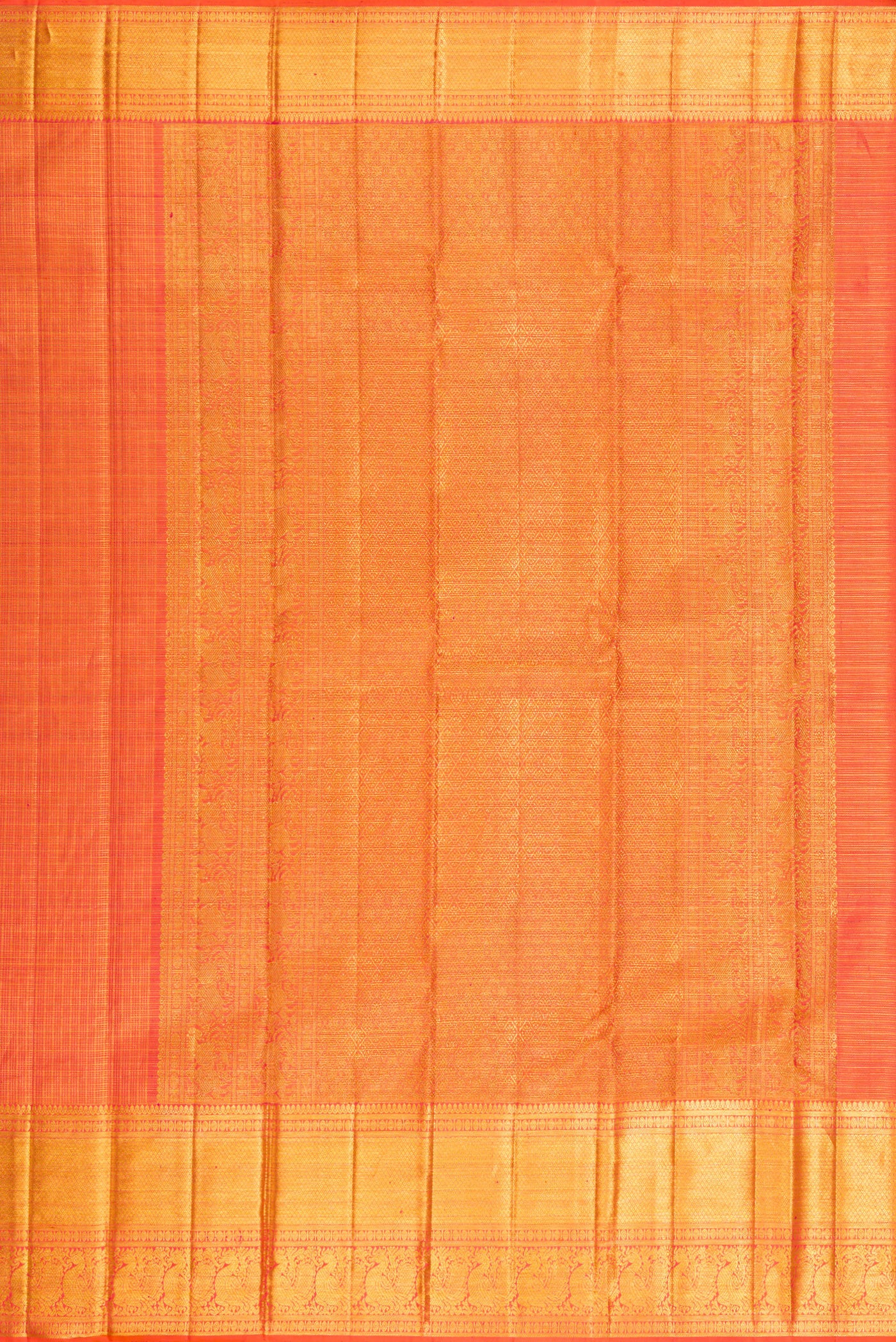 Close up image of the pallu of Orange Kanchipuram Silk Saree with Checked design on the body and Zari Border. 
