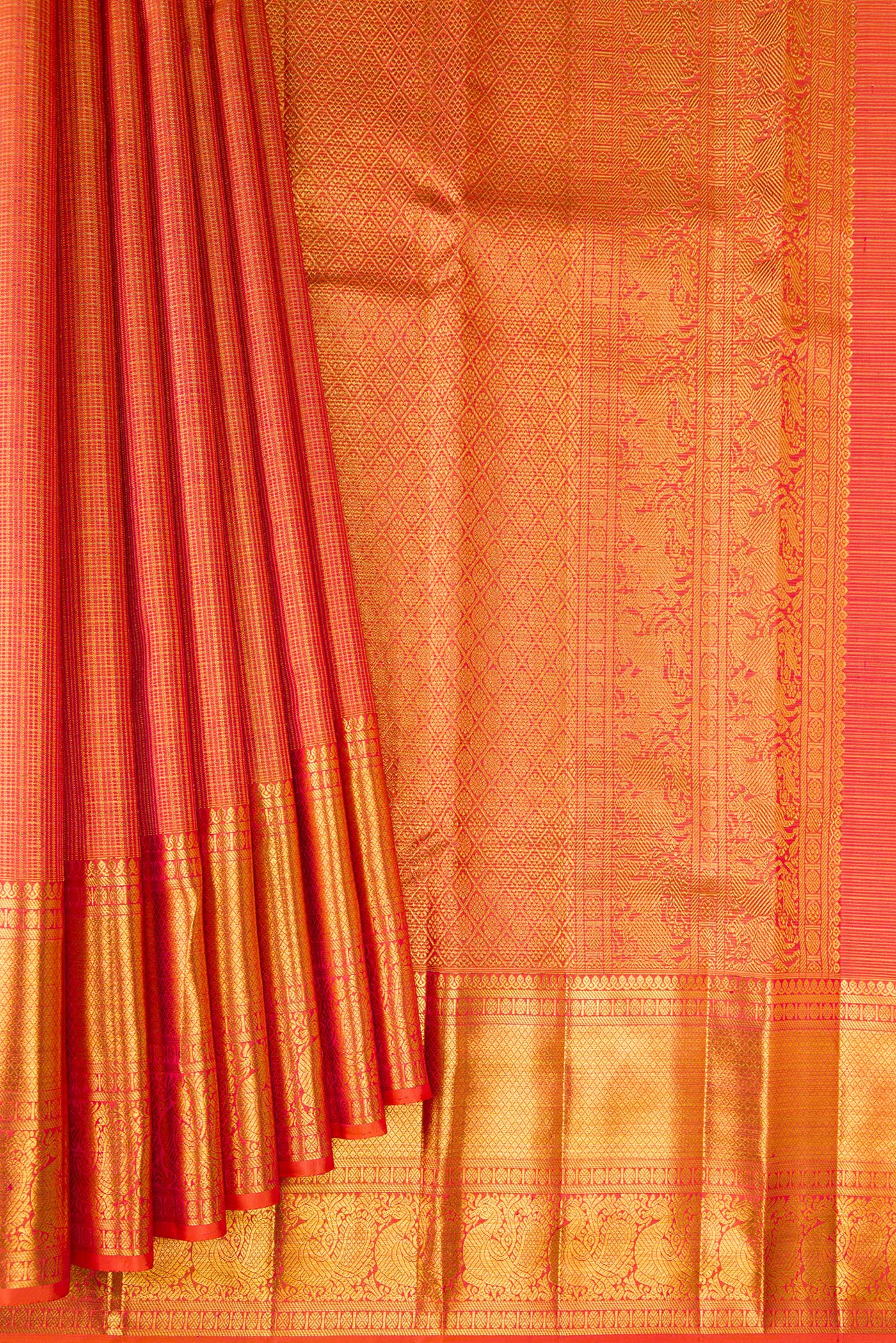 Pleats and pallu of Orange Kanchipuram Silk Saree with Checked design on the body and Zari Border. 