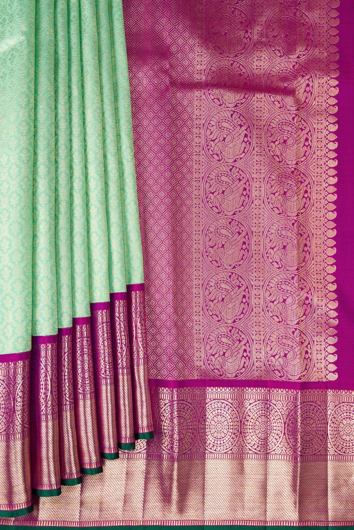 Pleats and pallu of Pure Silk Green Kanchipuram Saree with Zari Brocade on the body and Zari Border. 