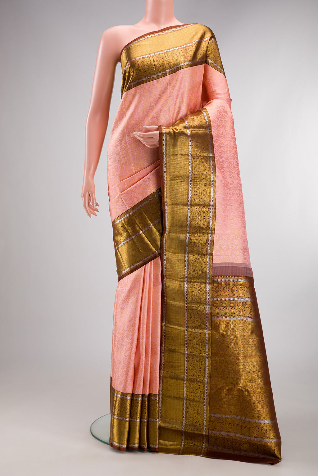Pure Silk Rose pink Kanchipuram Saree with Zari Brocade on the body and Zari Border.  displayed on a mannequin