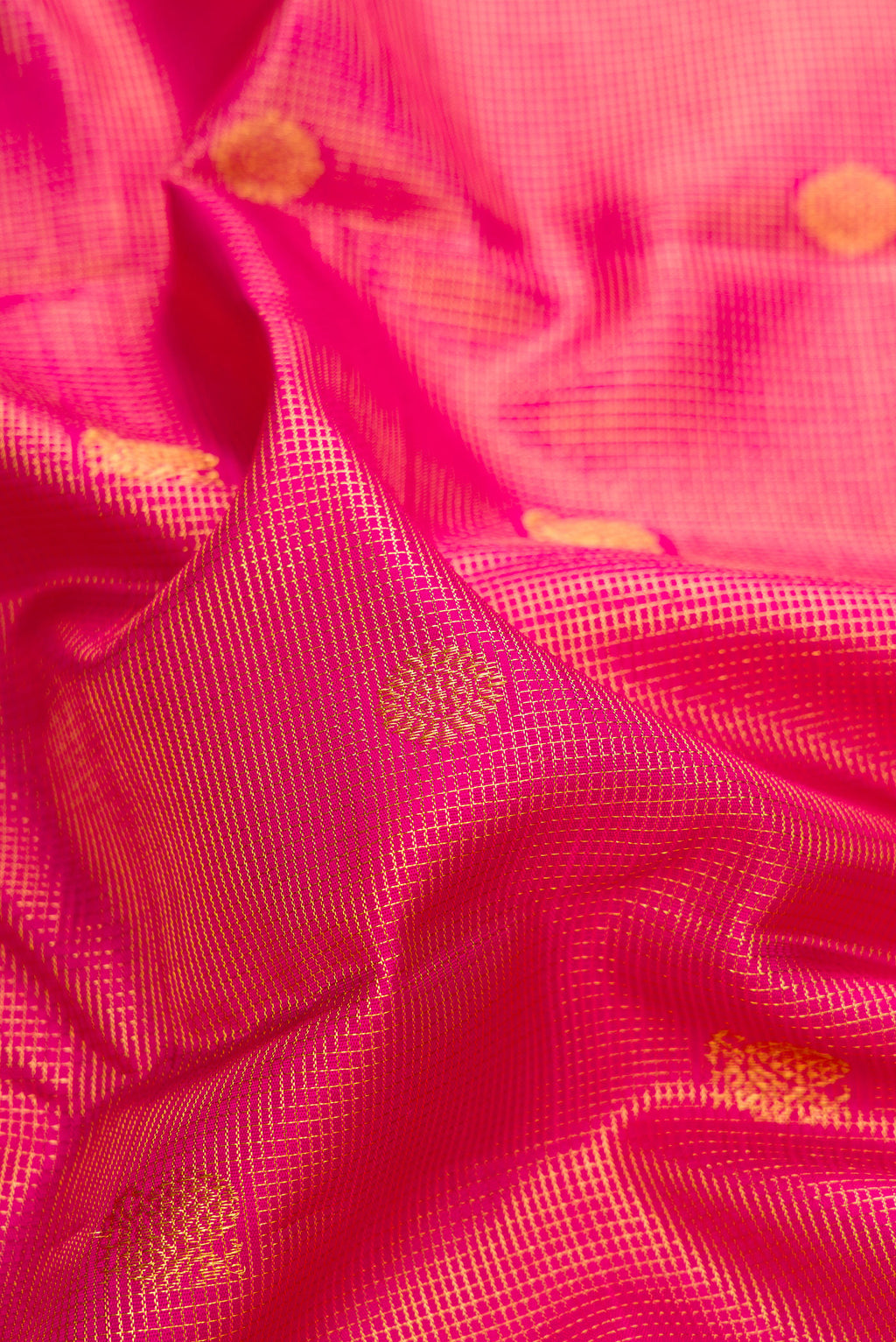 Close up of Pure Silk Dark Pink Kanchipuram Saree with Zari Brocade on the body and Zari Border.  displaying folds