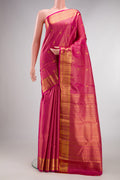 Pure Silk Dark Pink Kanchipuram Saree with Zari Brocade on the body and Zari Border.  displayed on a mannequin