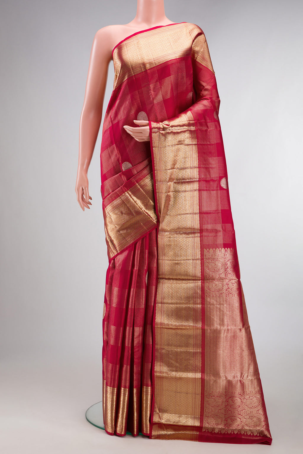 Pure Silk Maroon Kanchipuram Saree with Zari Brocade on the body and Zari Border.  displayed on a mannequin