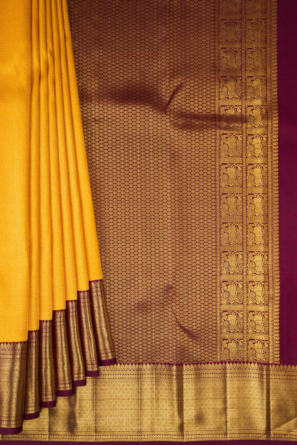 Pleats and pallu of Pure Silk Yellow Kanchipuram Saree with Zari Brocade on the body and Zari Border. 