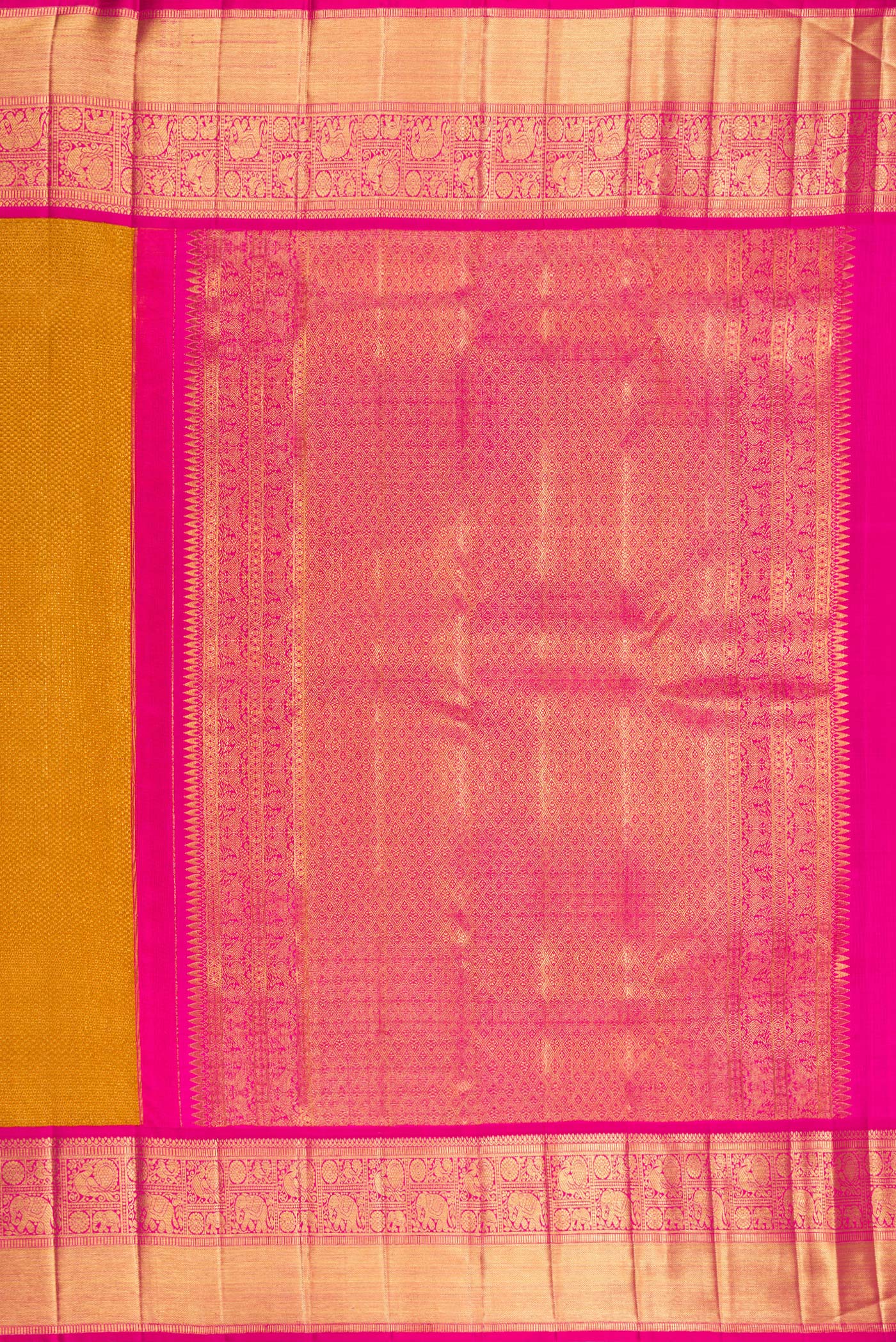 Close up image of the pallu of Mustard Kanchipuram Tissue Saree with Zari Brocade on the body and Zari Border. 