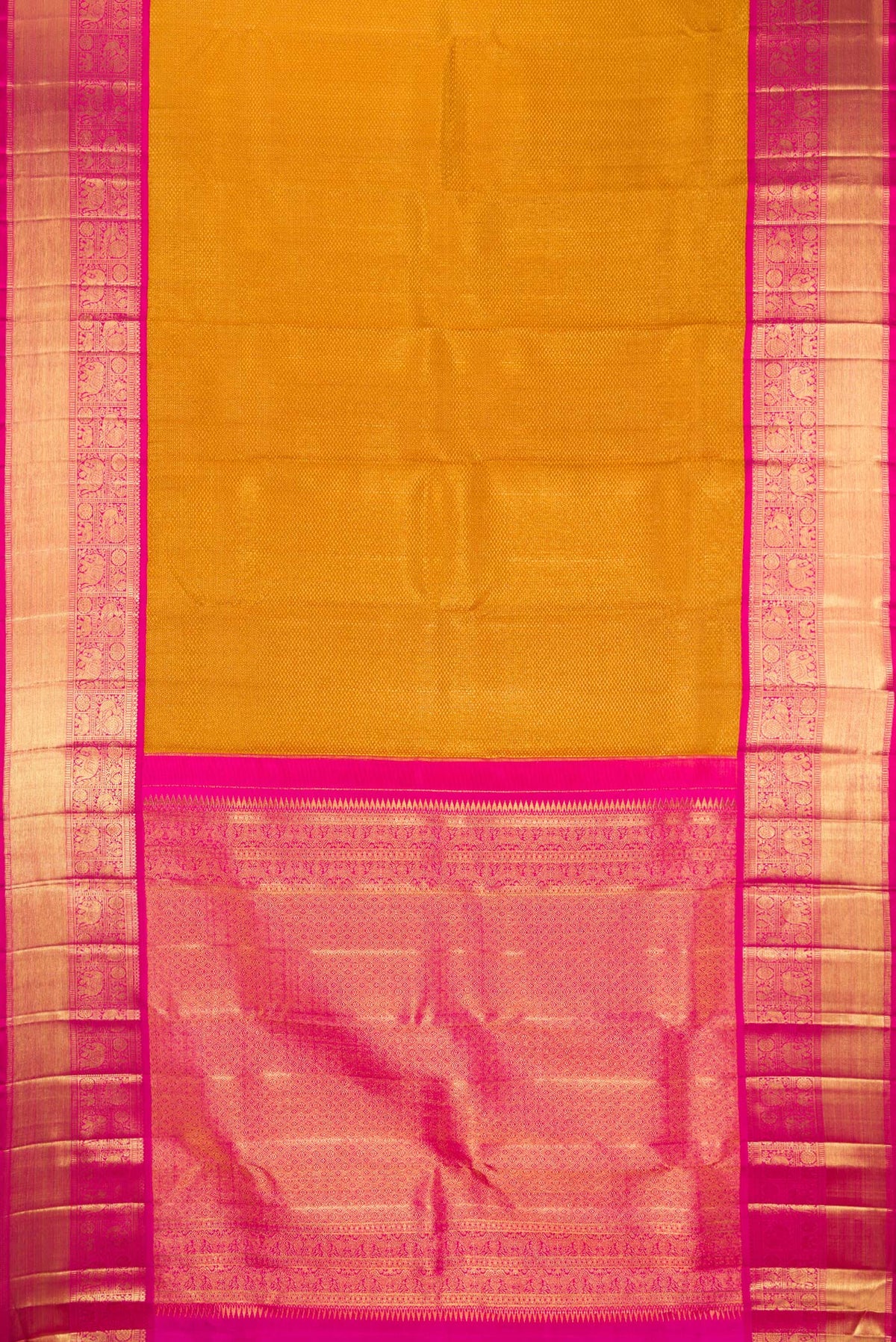 Flat view of Mustard Kanchipuram Tissue Saree with Zari Brocade on the body and Zari Border. 