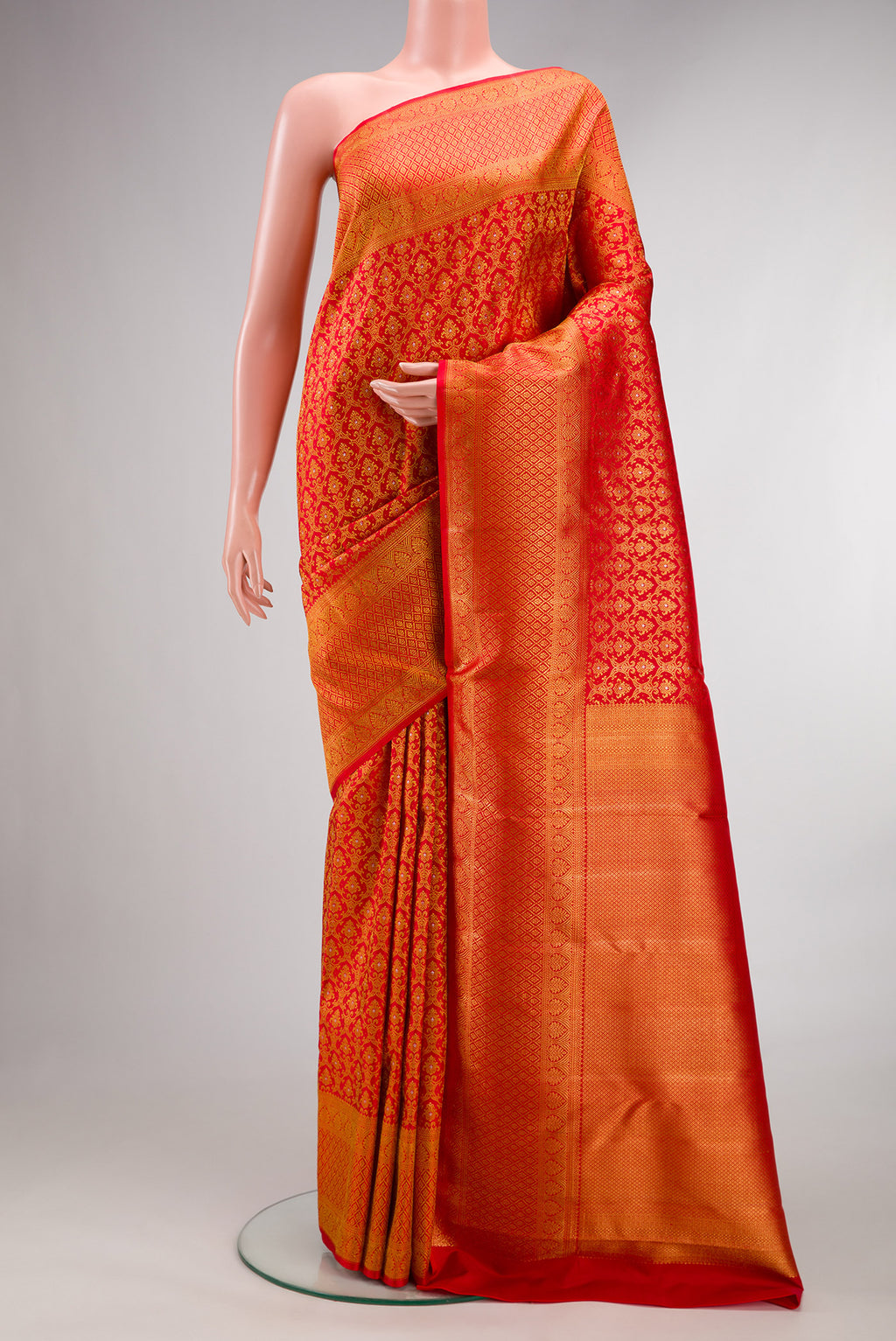 Pure Silk Red Kanchipuram Saree with Zari Brocade on the body and Fancy Border.  displayed on a mannequin