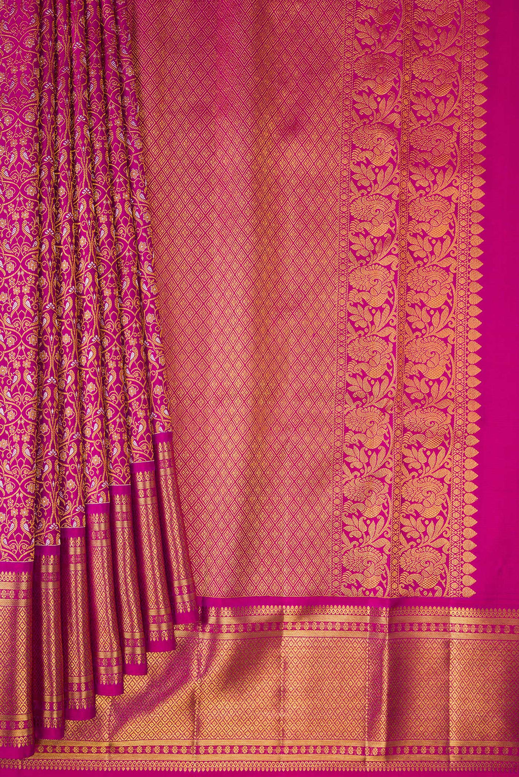 Pleats and pallu of Magenta Kanchipuram Silk Saree with Zari Brocade on the body and Zari Border. 