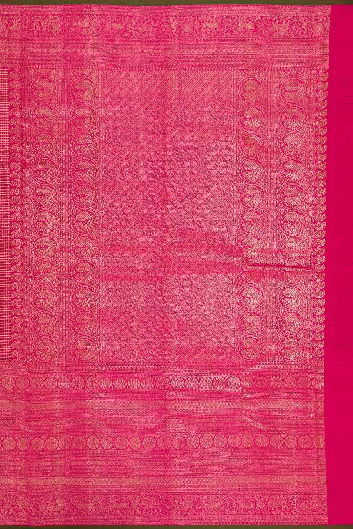 Close up image of the pallu of Pure Silk Dark Pink Kanchipuram Saree with Zari Brocade on the body and Fancy Border. 