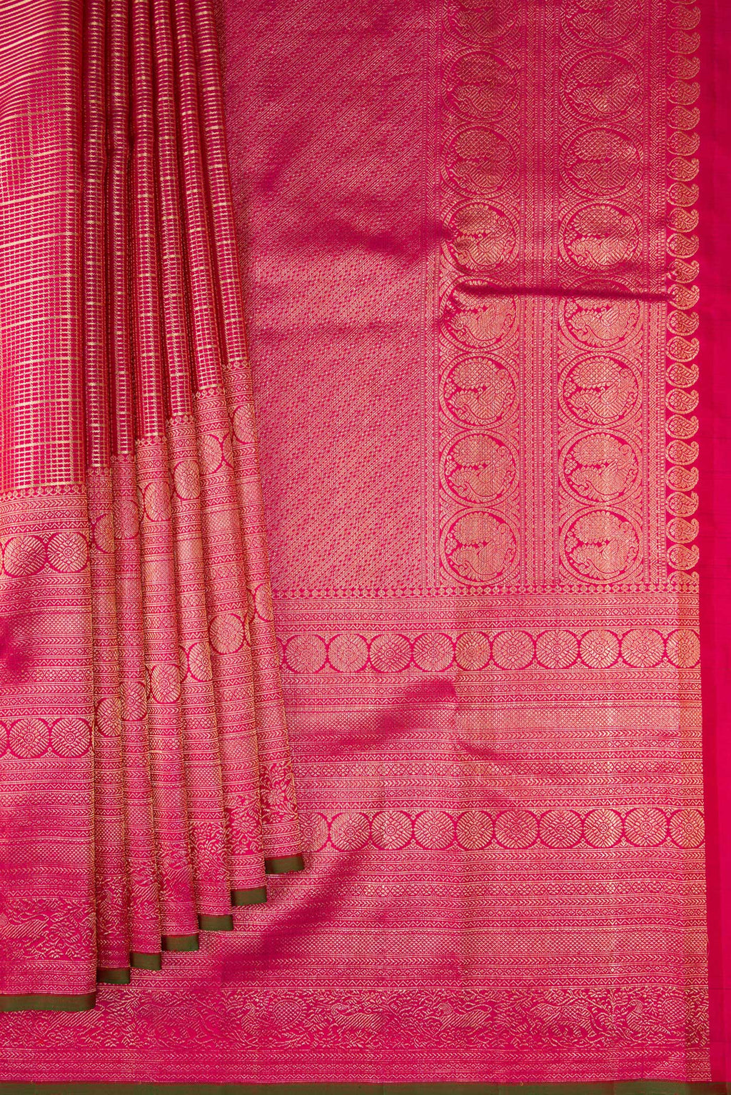 Pleats and pallu of Pure Silk Dark Pink Kanchipuram Saree with Zari Brocade on the body and Fancy Border. 