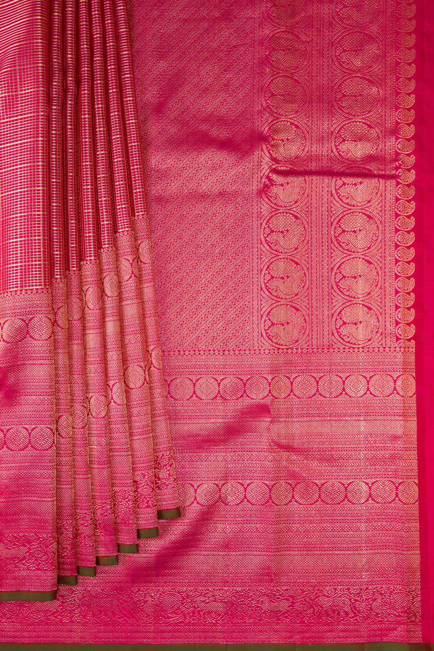 Pleats and pallu of Pure Silk Dark Pink Kanchipuram Saree with Zari Brocade on the body and Fancy Border. 