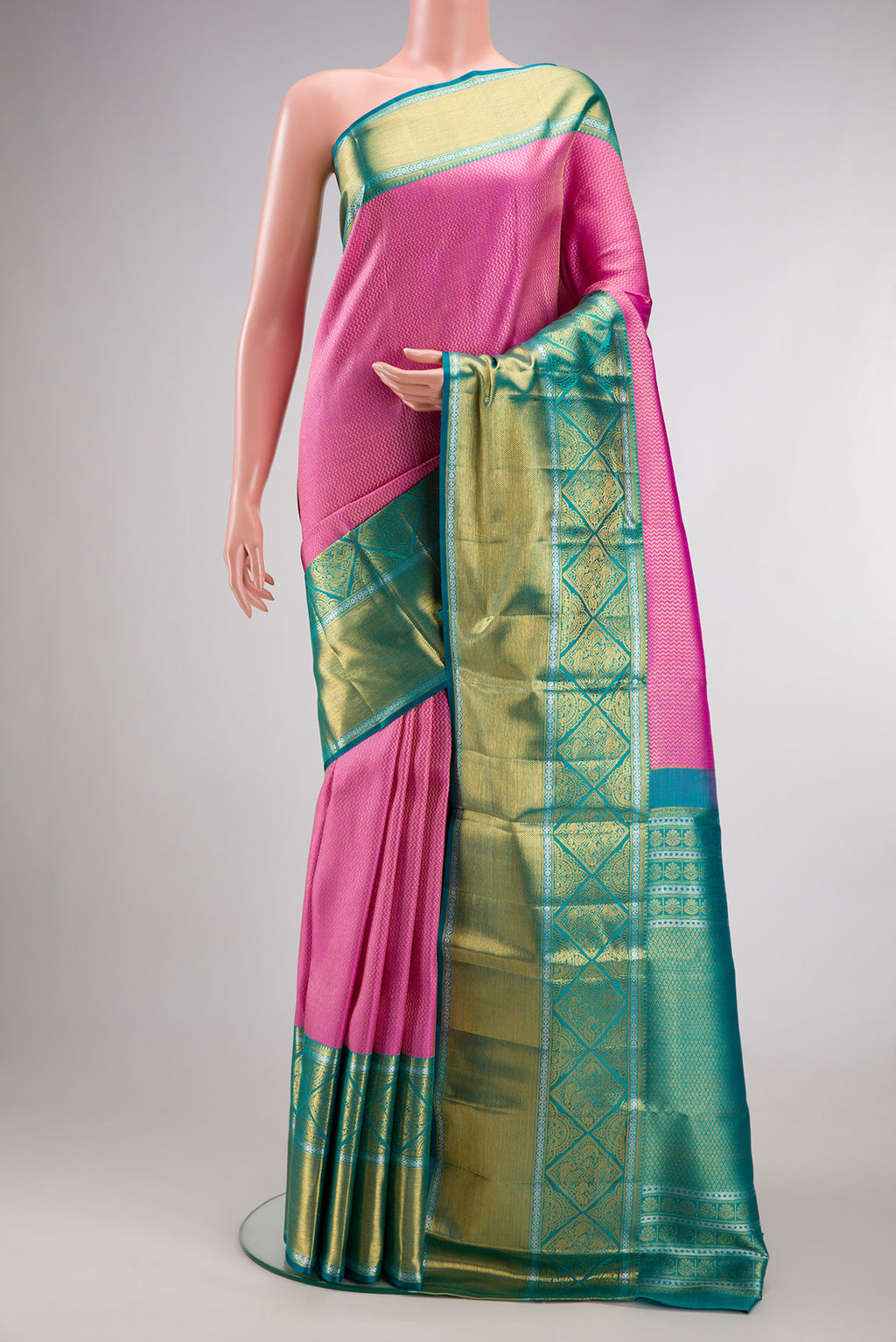 Pure Silk Rose pink Kanchipuram Saree with Zari Brocade on the body and Fancy Border.  displayed on a mannequin
