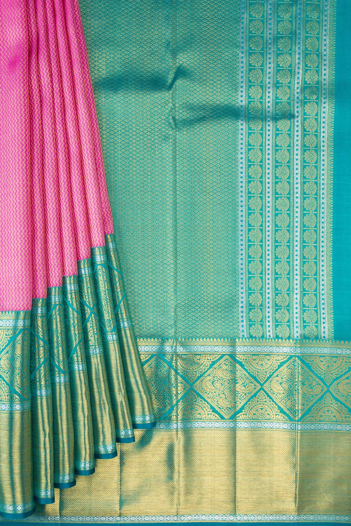Pleats and pallu of Pure Silk Rose pink Kanchipuram Saree with Zari Brocade on the body and Fancy Border. 