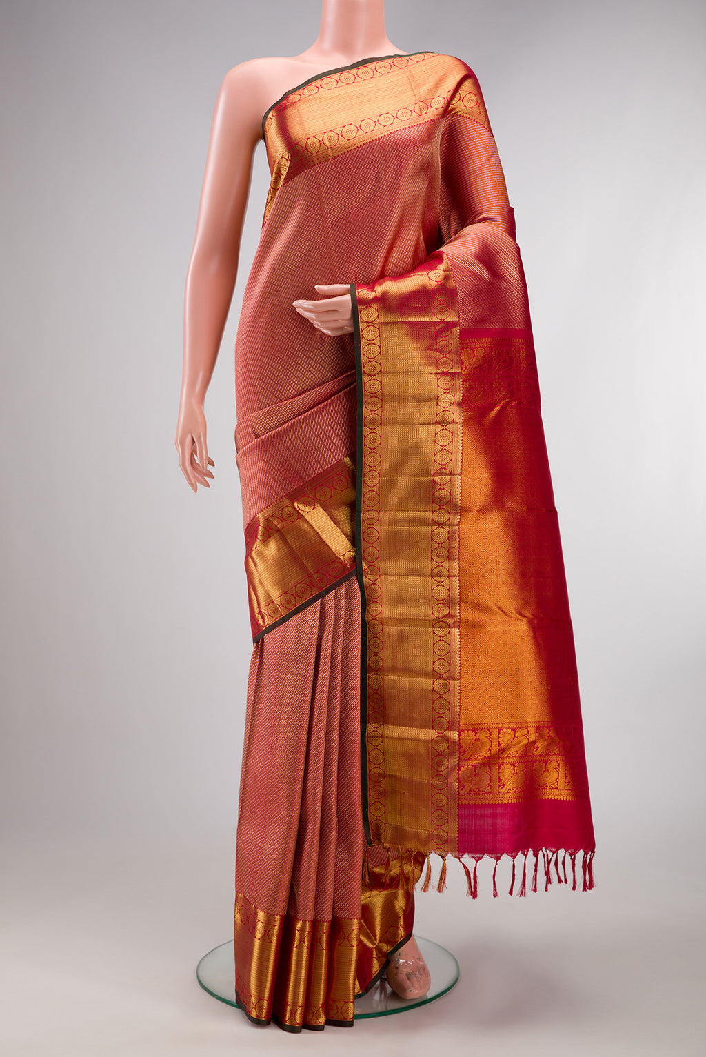 Pure Silk Maroon Dual Tone Kanchipuram Saree with Zari Brocade on the body and Zari Border.  displayed on a mannequin