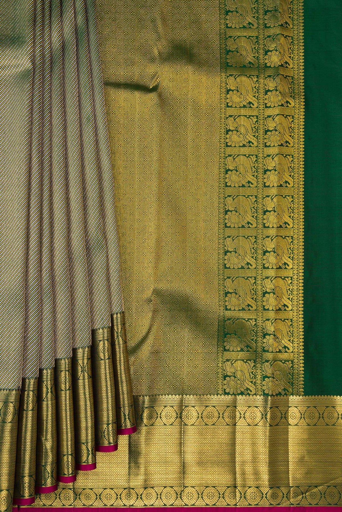 Pleats and pallu of Pure Silk Bottle Green Kanchipuram Saree with Zari Brocade on the body and Zari Border. 
