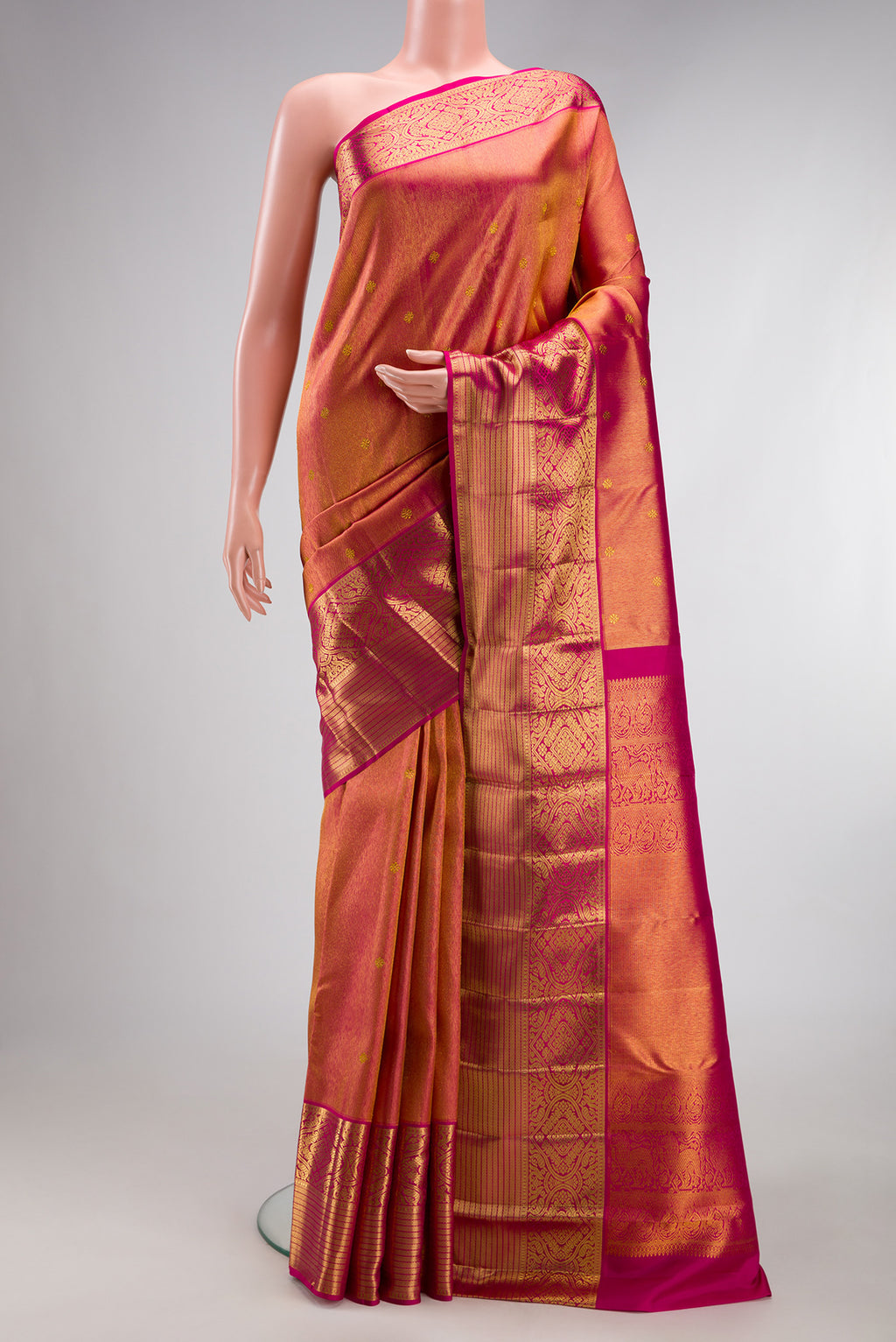 Dark Pink Kanchipuram Silk Saree with Zari Brocade on the body and Zari Border.  displayed on a mannequin