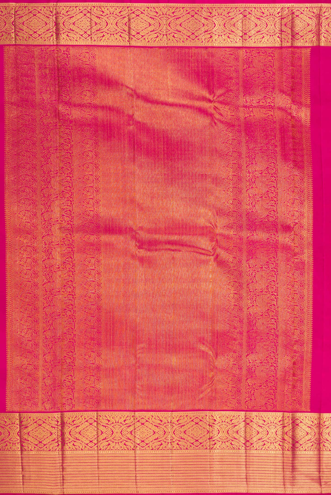 Close up image of the pallu of Dark Pink Kanchipuram Silk Saree with Zari Brocade on the body and Zari Border. 