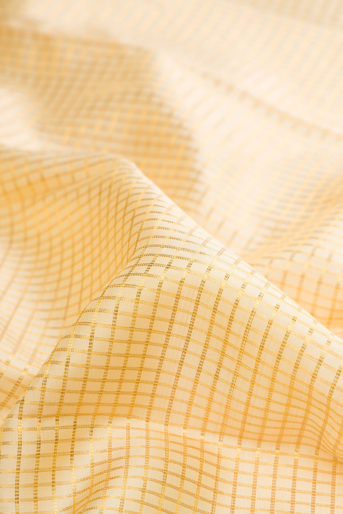 Close up of Pure Silk Sandal Kanchipuram Saree with Checked design on the body and Fancy Border.  displaying folds