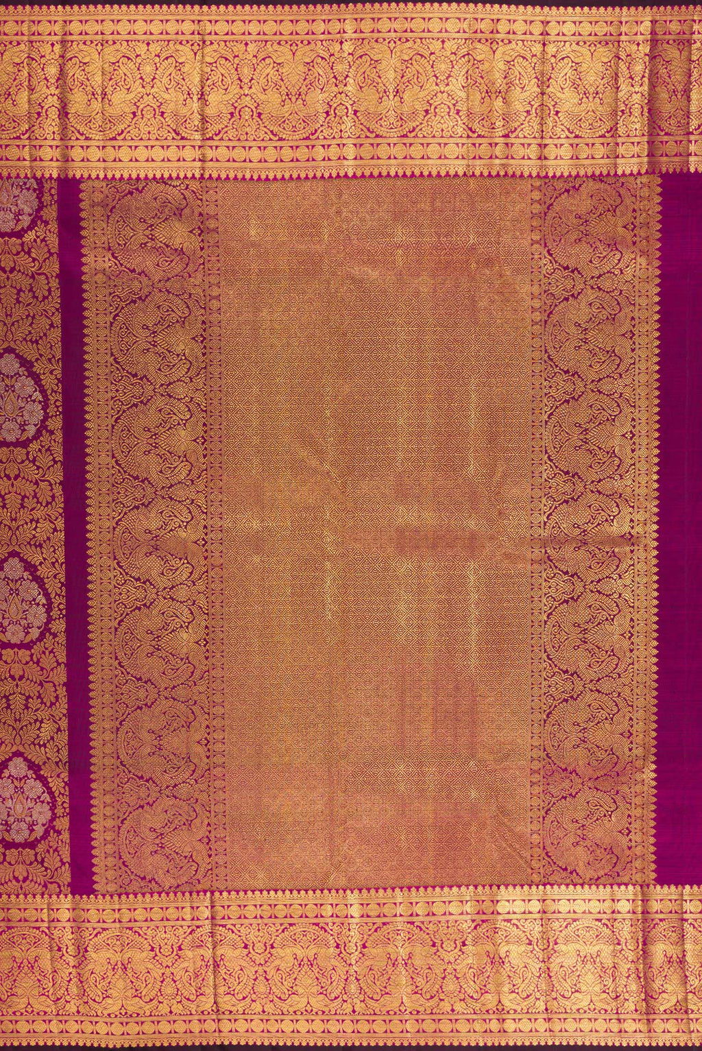 Close up image of the pallu of Pure Silk Magenta Kanjivaram Saree with Zari Brocade on the body and Zari Border. 
