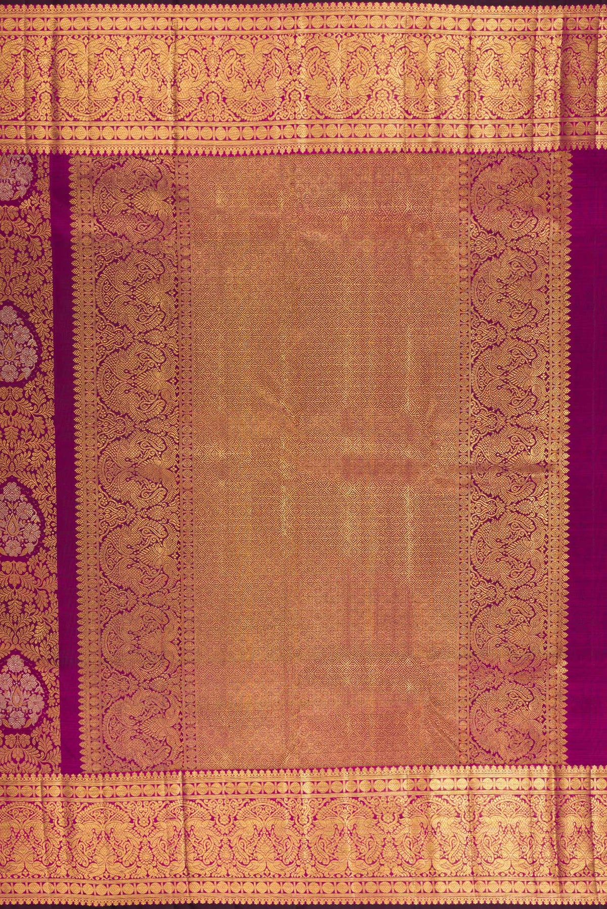 Close up image of the pallu of Pure Silk Magenta Kanjivaram Saree with Zari Brocade on the body and Zari Border. 