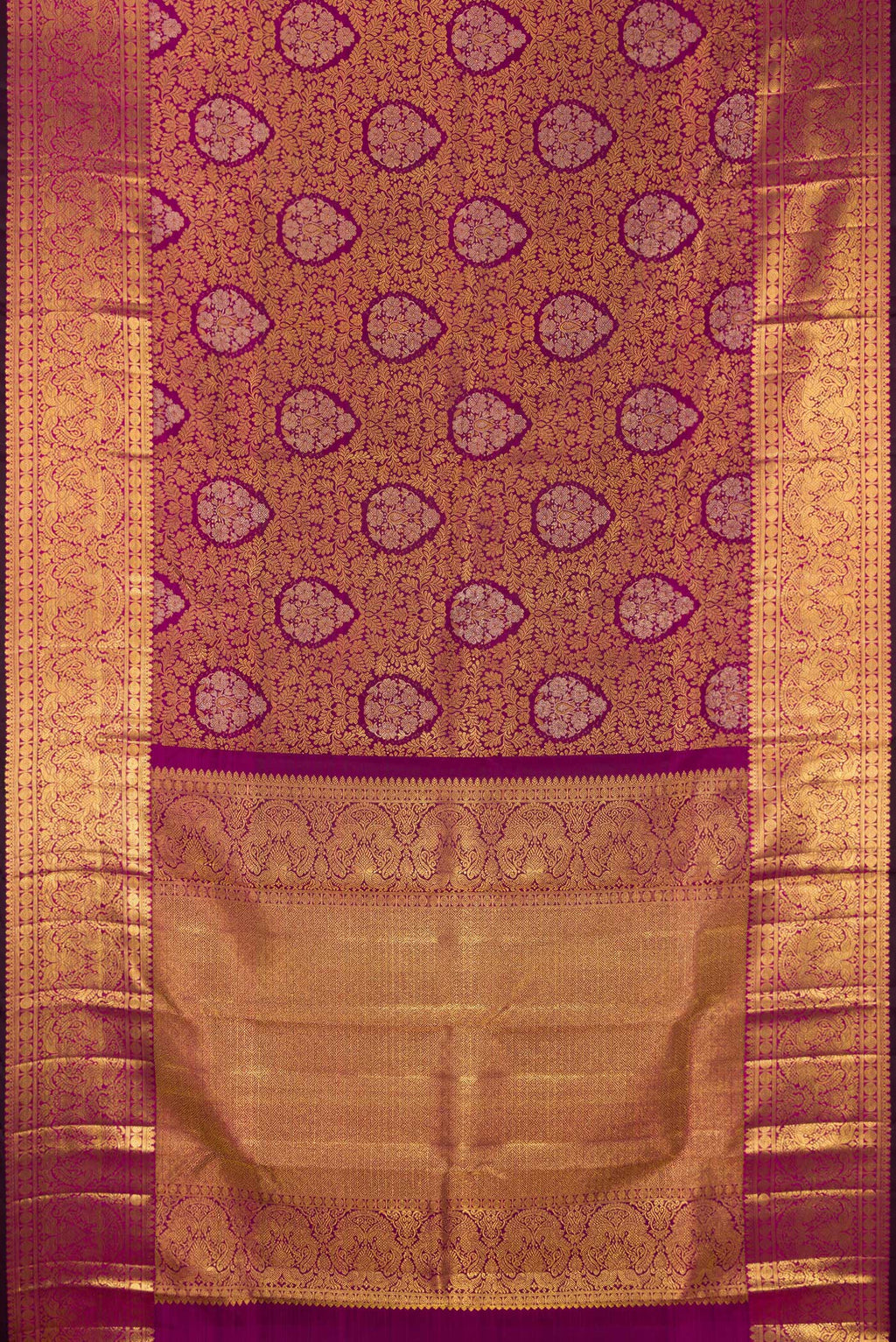 Flat view of Pure Silk Magenta Kanjivaram Saree with Zari Brocade on the body and Zari Border. 