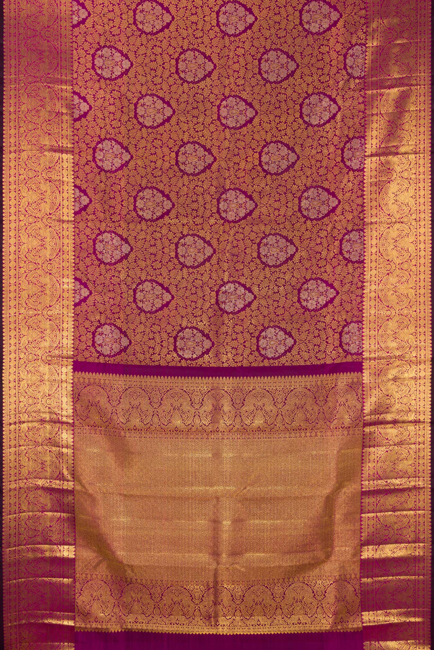 Flat view of Pure Silk Magenta Kanjivaram Saree with Zari Brocade on the body and Zari Border. 